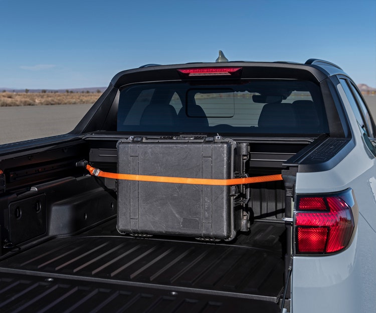 Adjustable rail and cleat system with six tie-down points